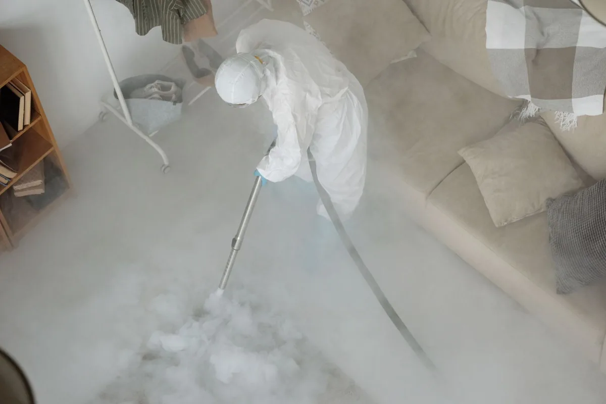 Biohazard cleanup technician in protective equipment, Hamilton, AL
